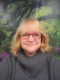 Grete Eide is smiling at the camera. 