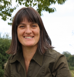 Helen McCain is smiling at the camera.