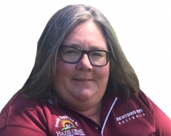 Jo Baker is smiling at the camera. 