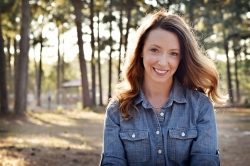 Kyria Henry Whisenhunt is smiling at the camera. 