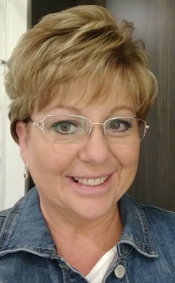 Michelle Woerner is smiling at the camera. 